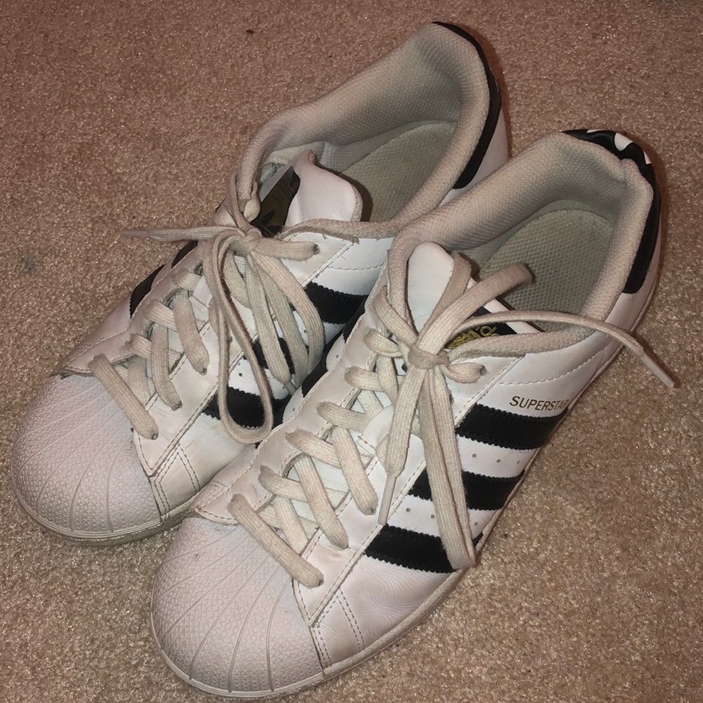 worn out Adidas superstars